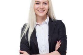 Young blonde businesswoman smile, folded hands, attractive business woman, student girl